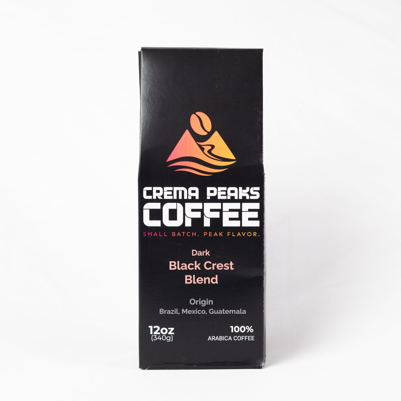 A tall black coffee box labeled Crema Peaks Coffee Dark Black Crest Blend, shown upright on a clean white background.