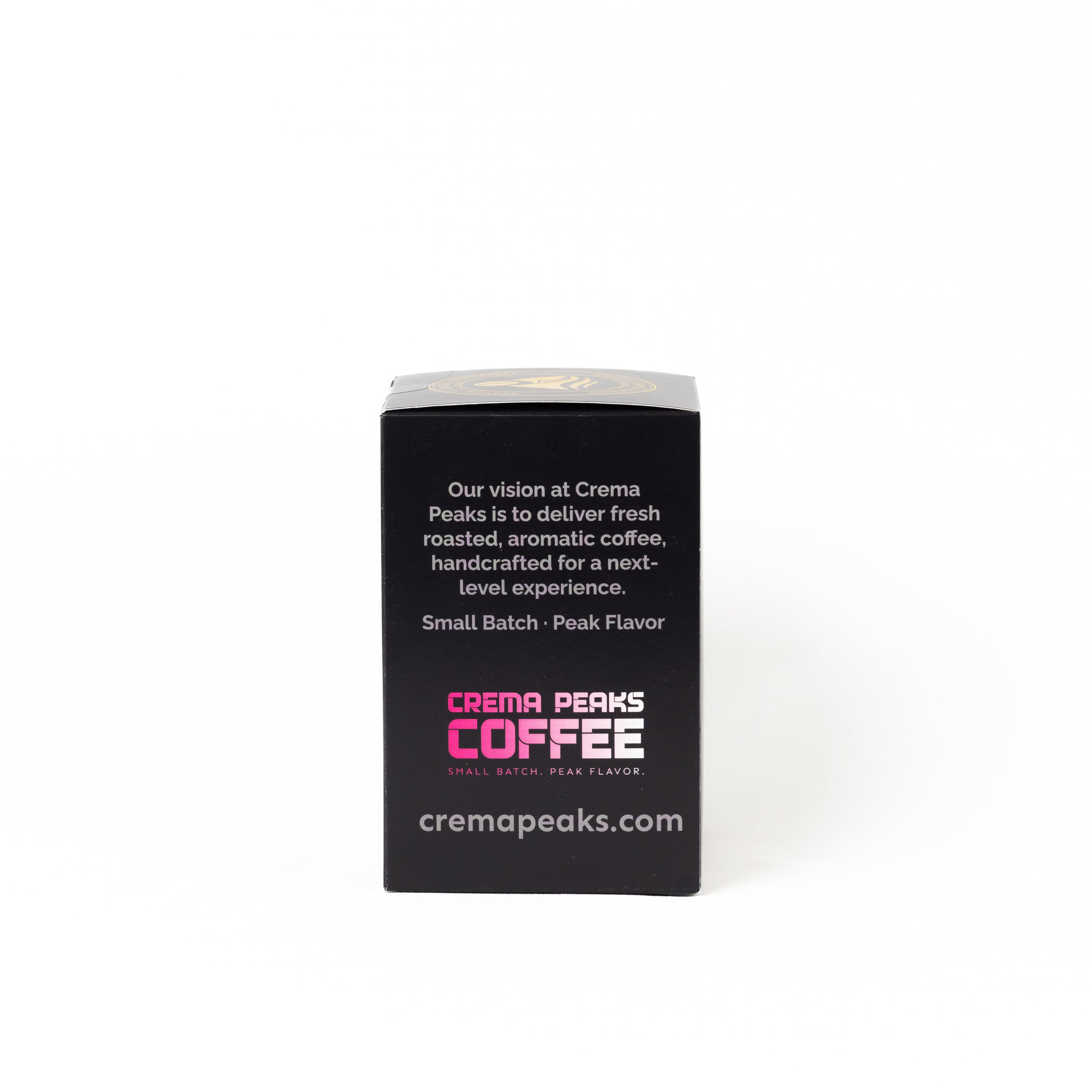 A black rectangular coffee box with a silver lid, featuring the Crema Peaks Coffee logo and website on a white background.