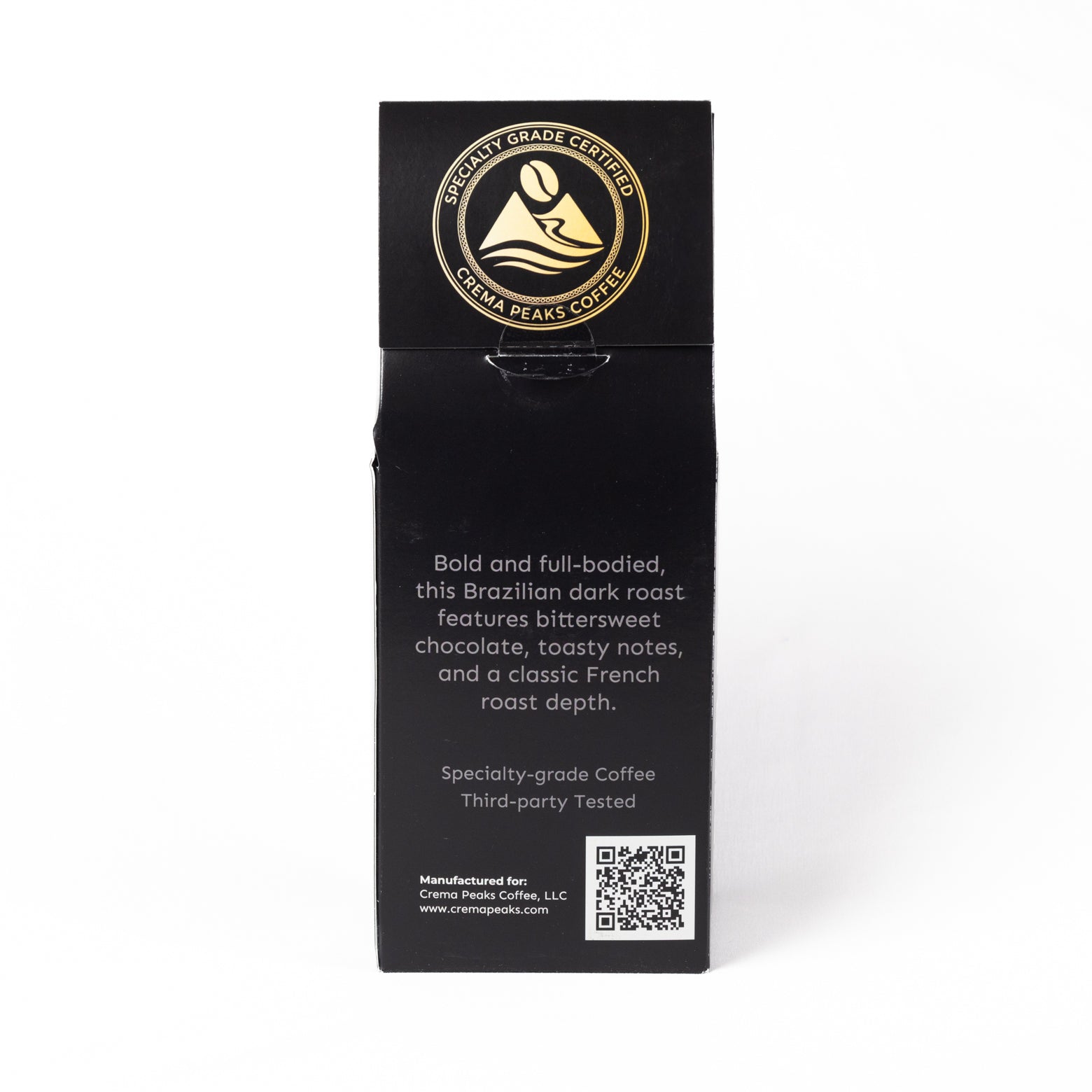 A tall, black rectangular package for Crema Peaks Coffee Specialty Grade  Brazilian coffee, featuring a gold circular logo and white text on a white background.