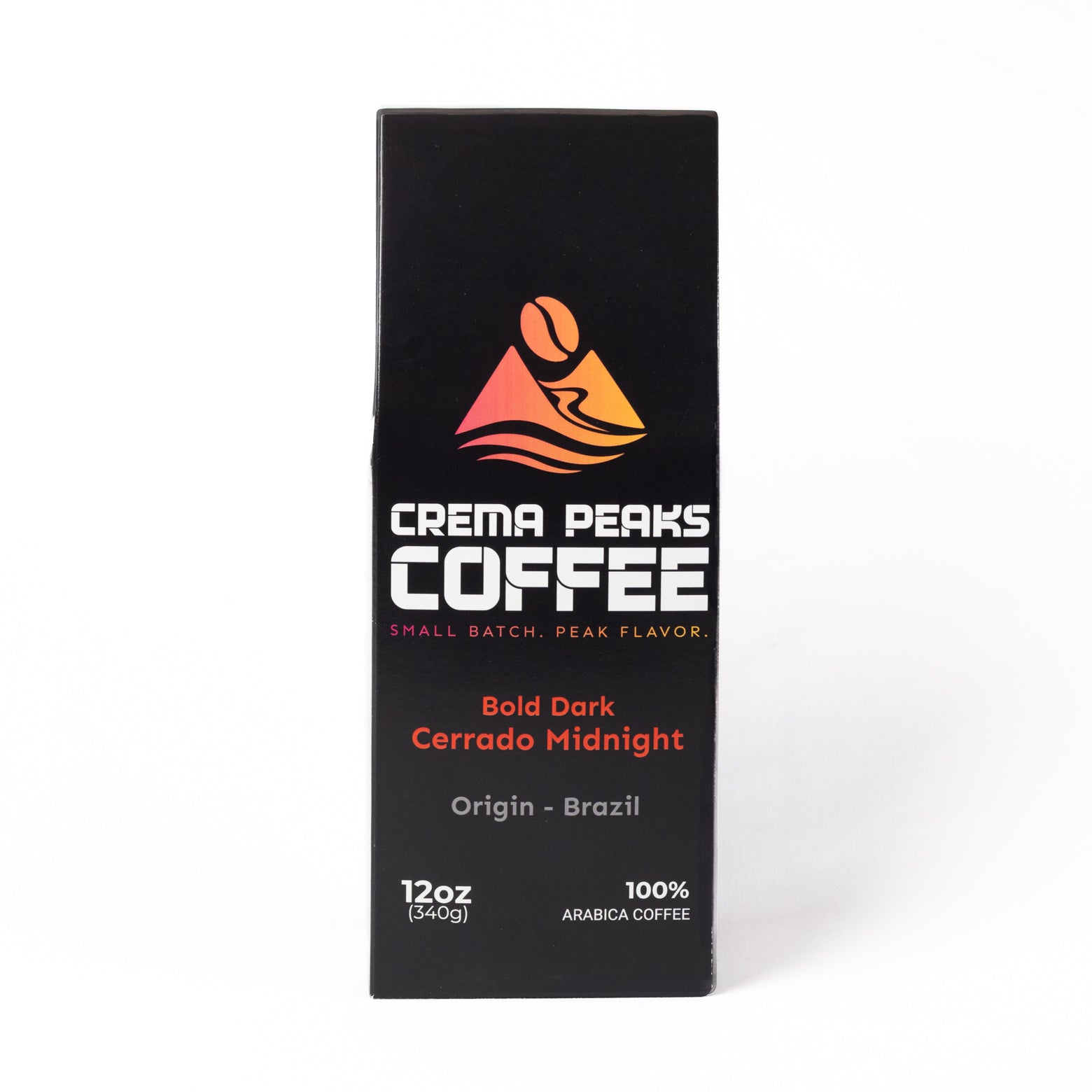 A tall, narrow black coffee package from Crema Peaks Coffee, featuring a colorful mountain logo and text for the Bold Dark Cerrado Midnight, on a clean white background.
