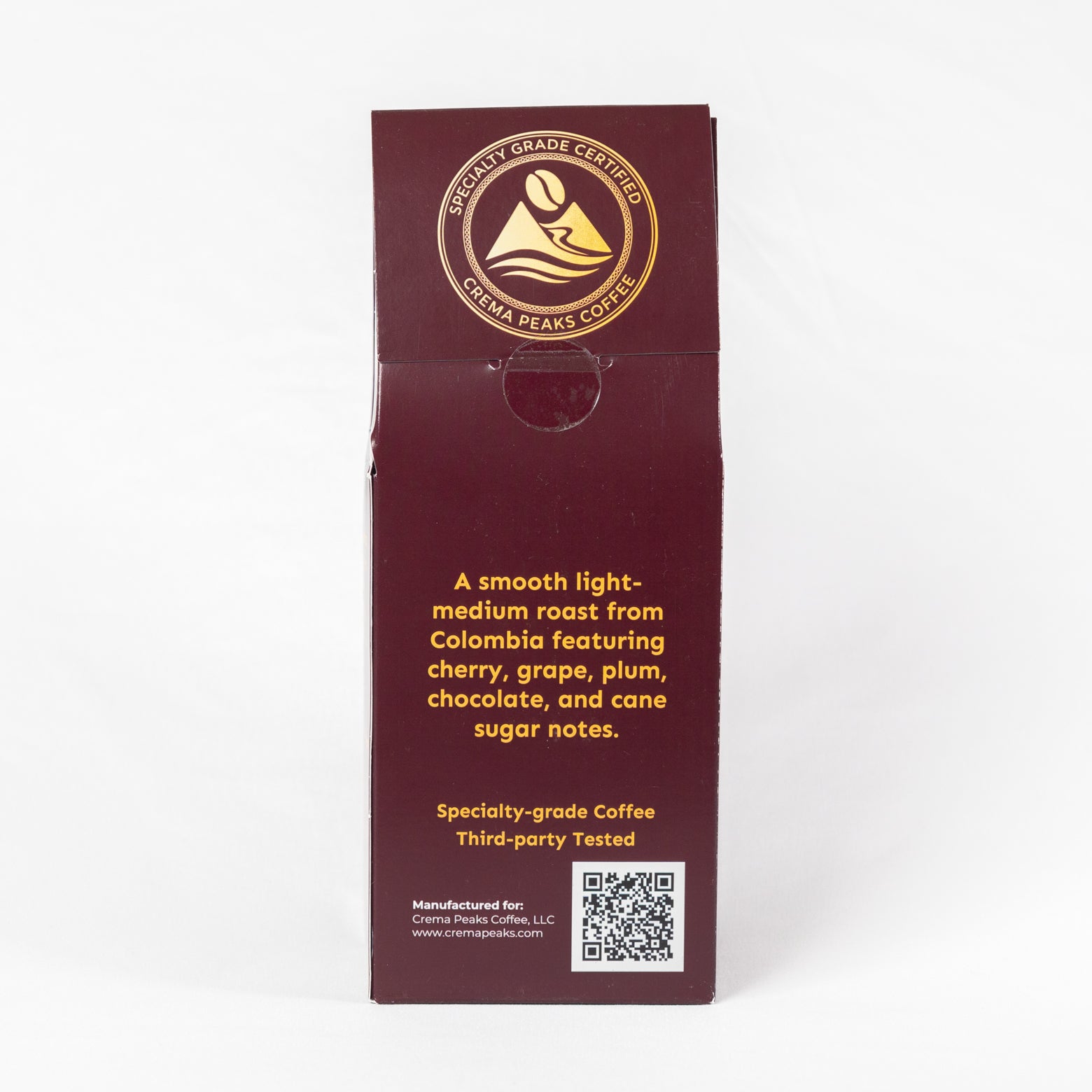 A tall, narrow coffee bag or packaging panel shown upright against a plain white background. The package is dark burgundy with gold printed text and a circular logo near the top.