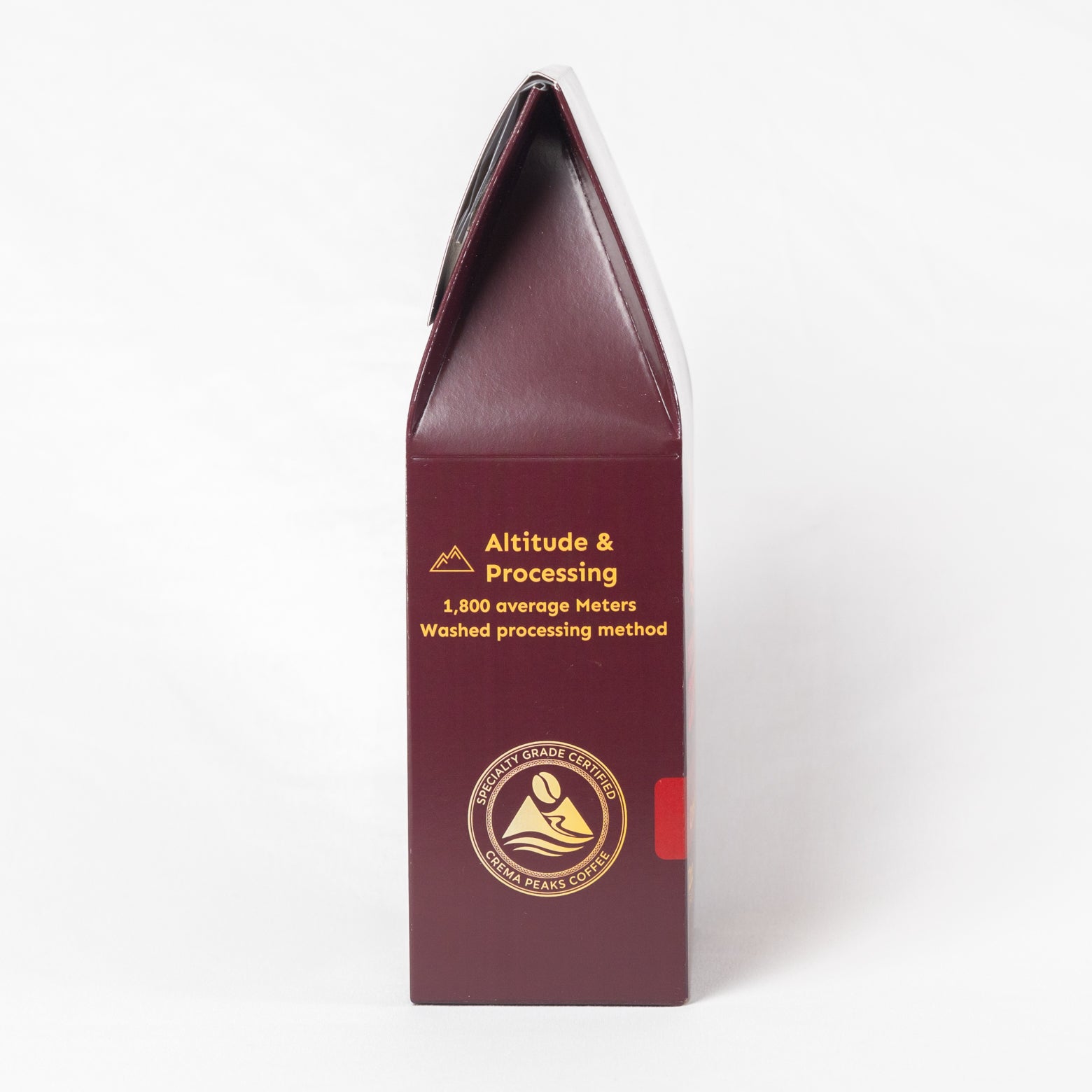 A tall, narrow dark burgundy box with gold text reading 'Altitude & Processing' and a circular logo near the bottom, photographed on a clean white background.