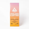 A 12oz box of Crema Peaks Coffee Light Golden Compass arabica coffee, featuring a pink-to-orange gradient packaging design with white and black text on a clean white background.
