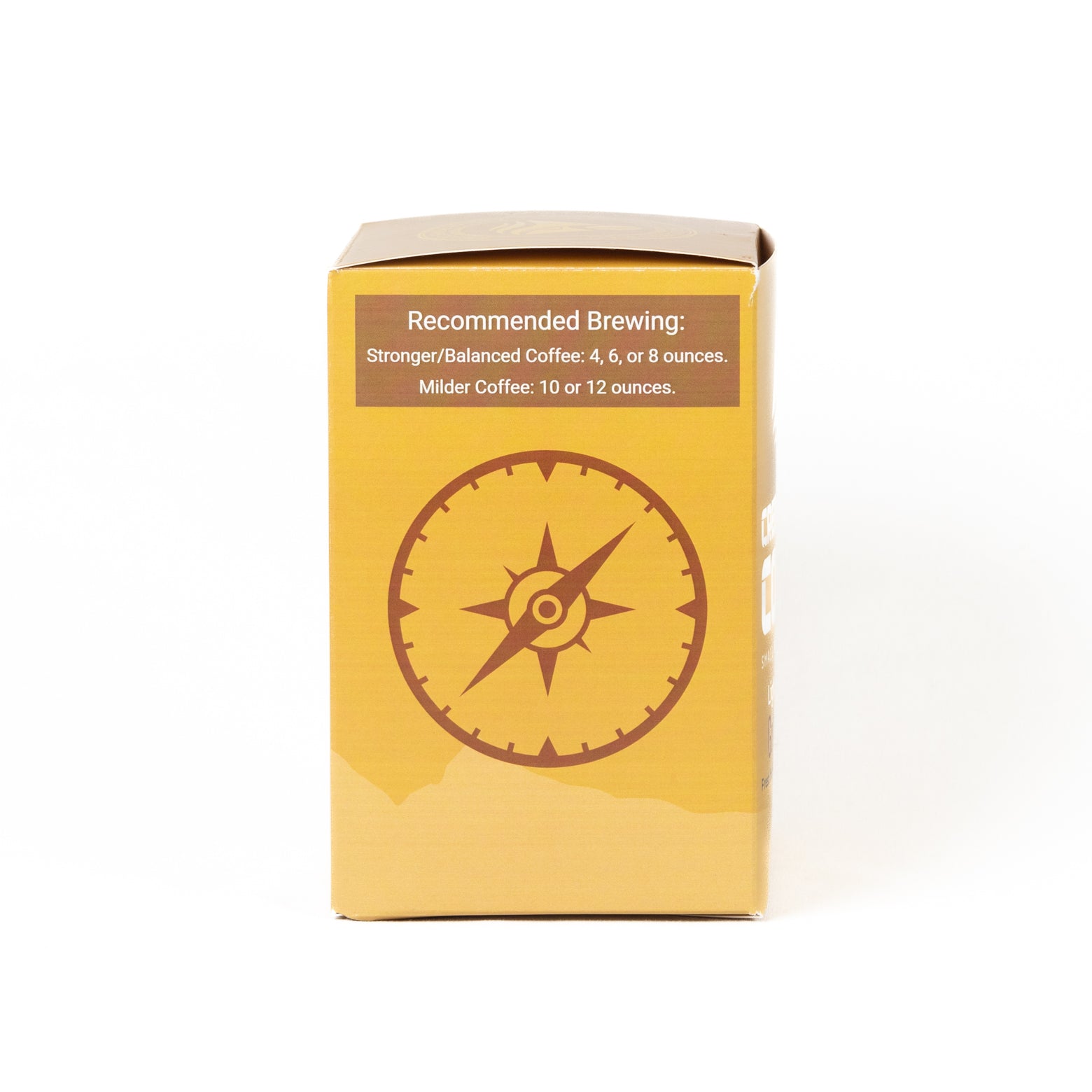 A yellow cardboard box with a brown compass graphic and brewing recommendations printed on the front, photographed against a plain white background.