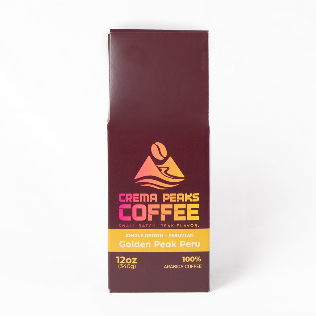 A 12oz bag of Crema Peaks Coffee Golden Peak Peru single origin arabica coffee, shown on a clean white background.