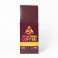 A 12oz bag of Crema Peaks Coffee Golden Peak Peru single origin arabica coffee, shown on a clean white background.