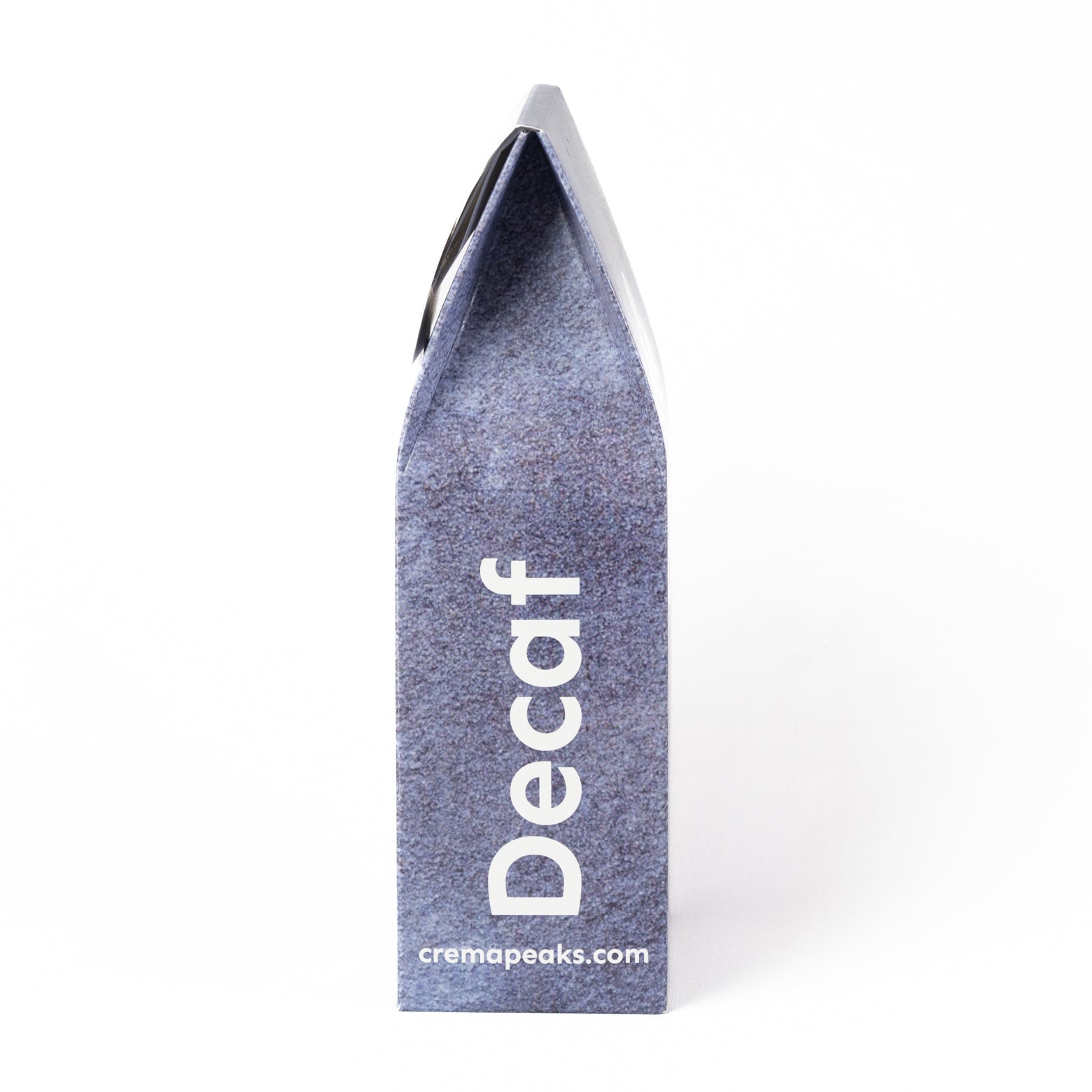 A tall, narrow gray box with a textured surface, featuring the word 'Decaf' printed vertically in white and the website 'cremapeaks.com' at the bottom, set against a plain white background.