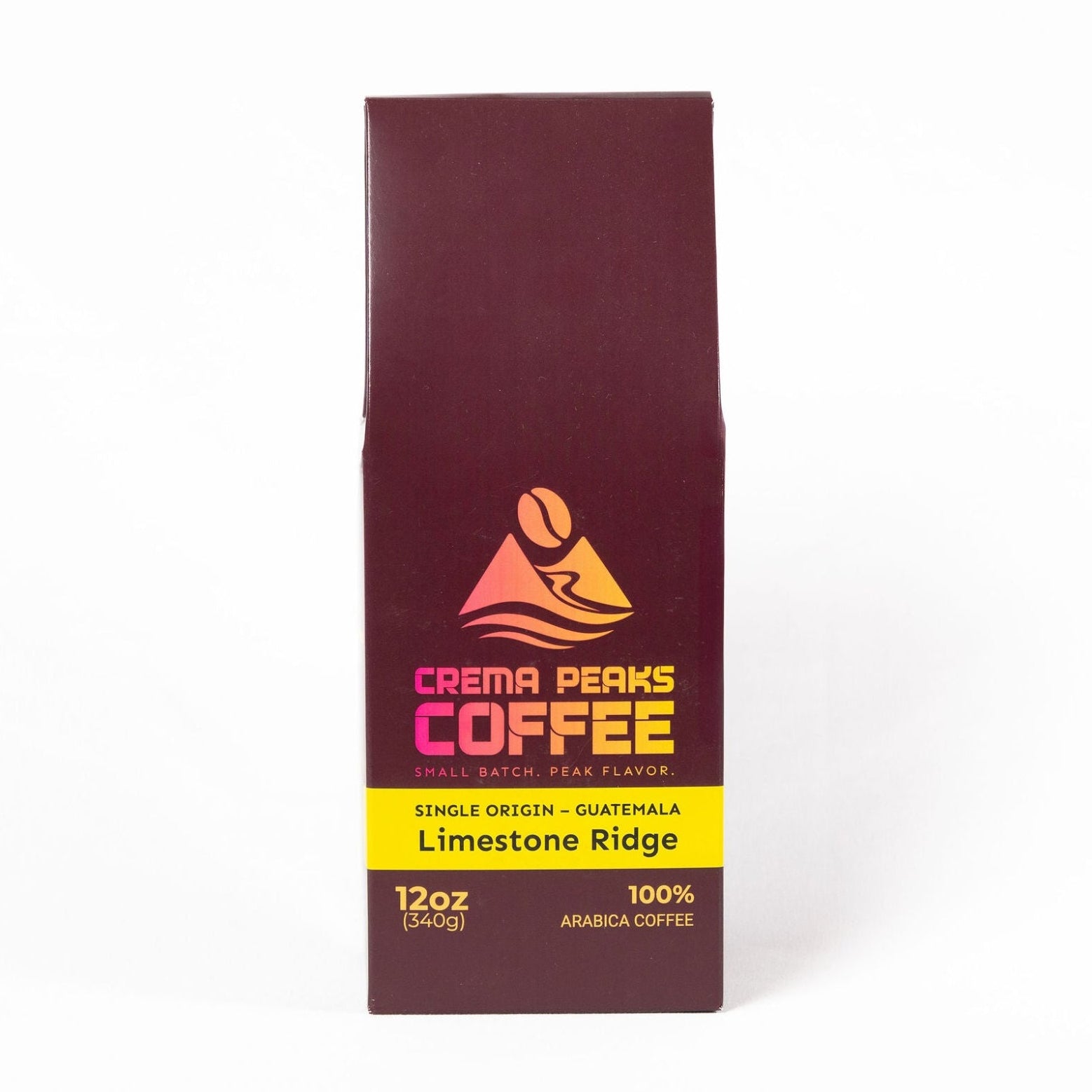A 12 oz bag of Crema Peaks Coffee Limestone Ridge single origin Guatemala coffee, shown in its dark maroon paper packaging with a yellow and orange logo on a white background.