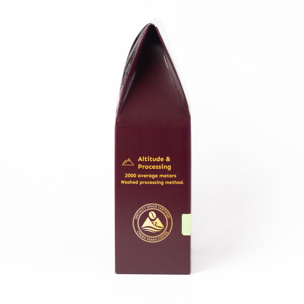 A tall, narrow dark burgundy box with gold text reading 'Altitude & Processing' and a circular gold seal near the bottom, photographed on a clean white background.