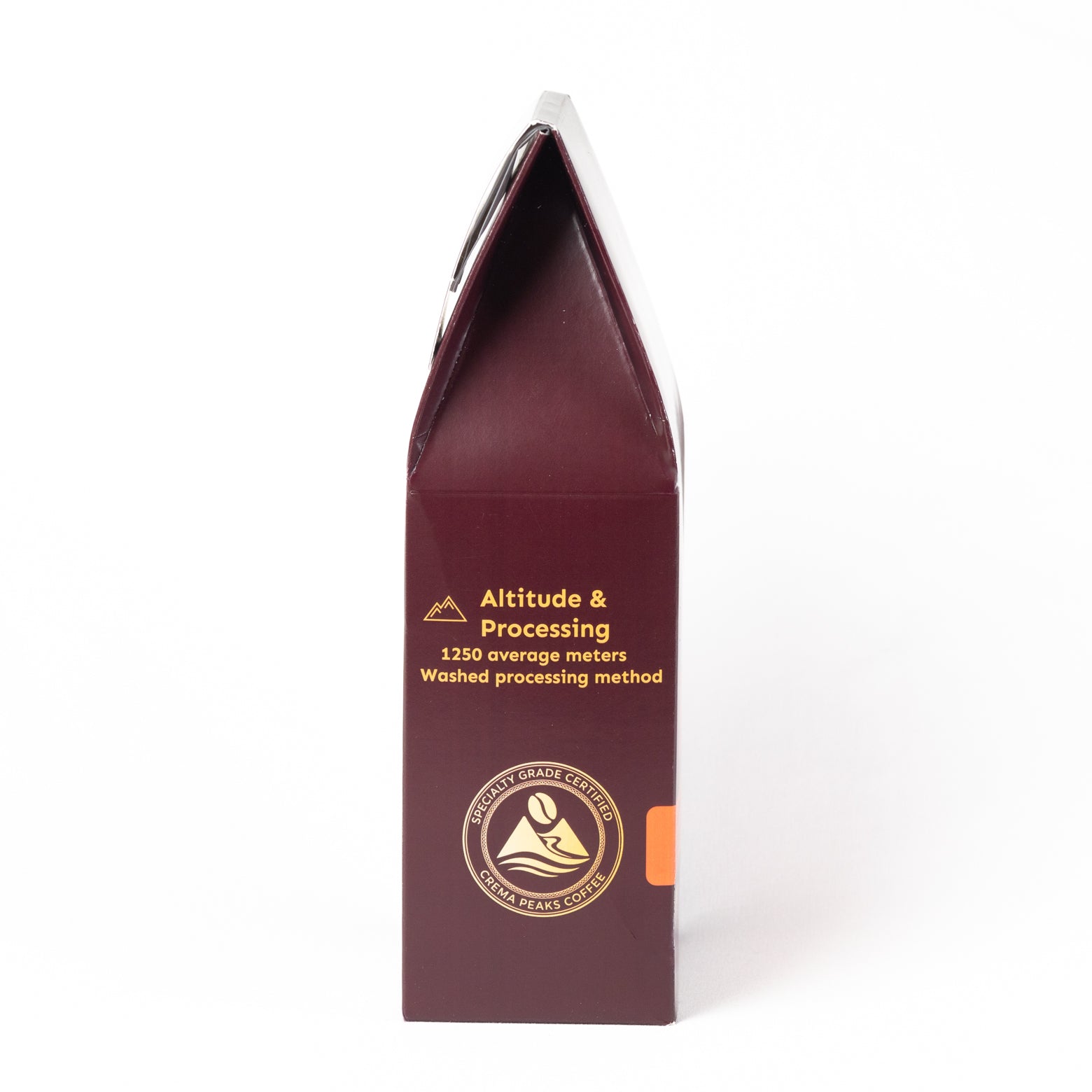 A tall, narrow dark burgundy package with gold text reading 'Altitude & Processing' and a circular coffee bean logo, photographed on a clean white background.
