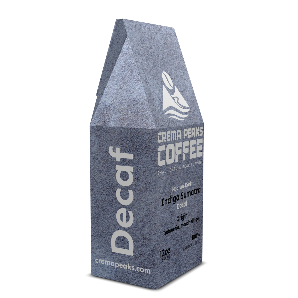 Decaf coffee package with Crema Peaks Coffee branding on a white background